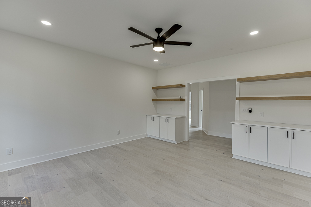 5422 Copper Crk Road Flowery Branch, GA 30542 - Photo 37 of 57 an empty room with closet and windows