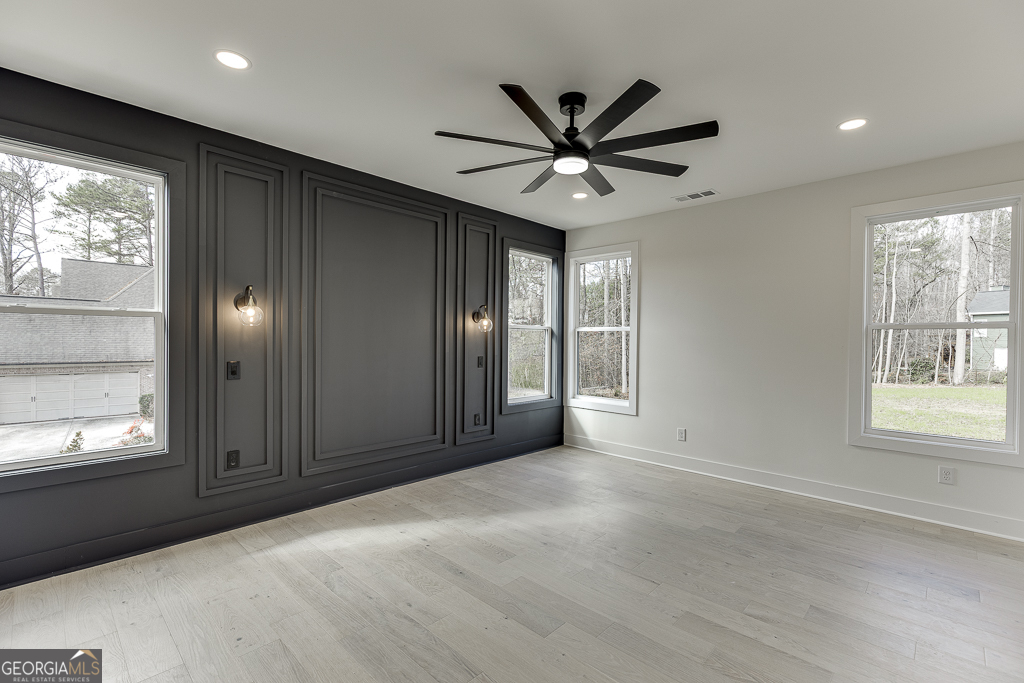 5422 Copper Crk Road Flowery Branch, GA 30542 - Photo 38 of 57 a view of an empty room with window and chandelier fan