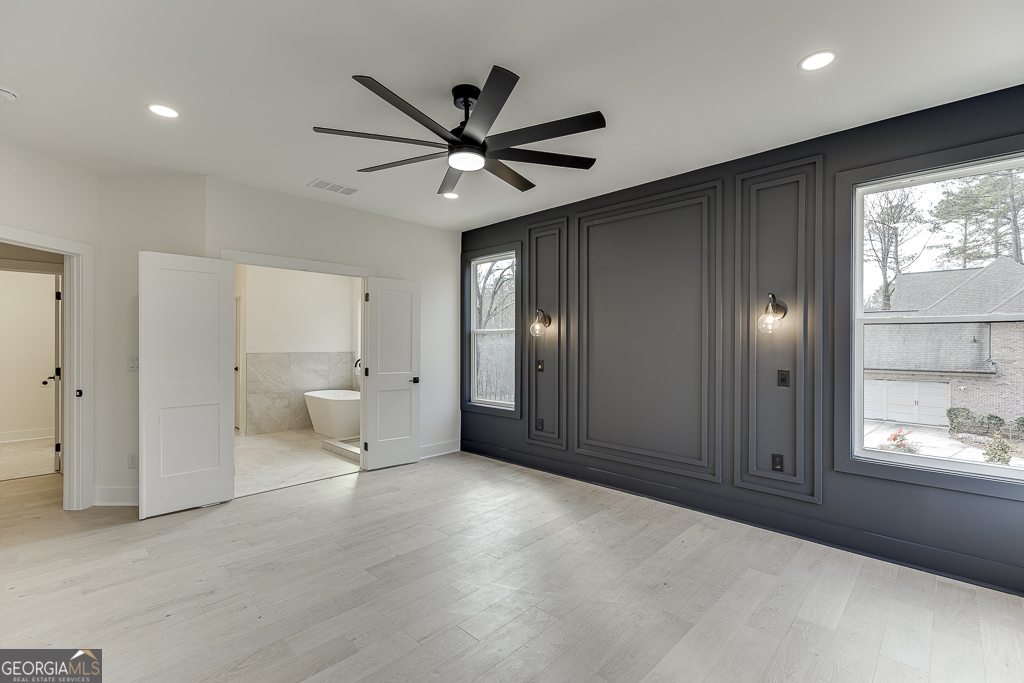 5422 Copper Crk Road Flowery Branch, GA 30542 - Photo 41 of 57 a view of a livingroom with a ceiling fan and window