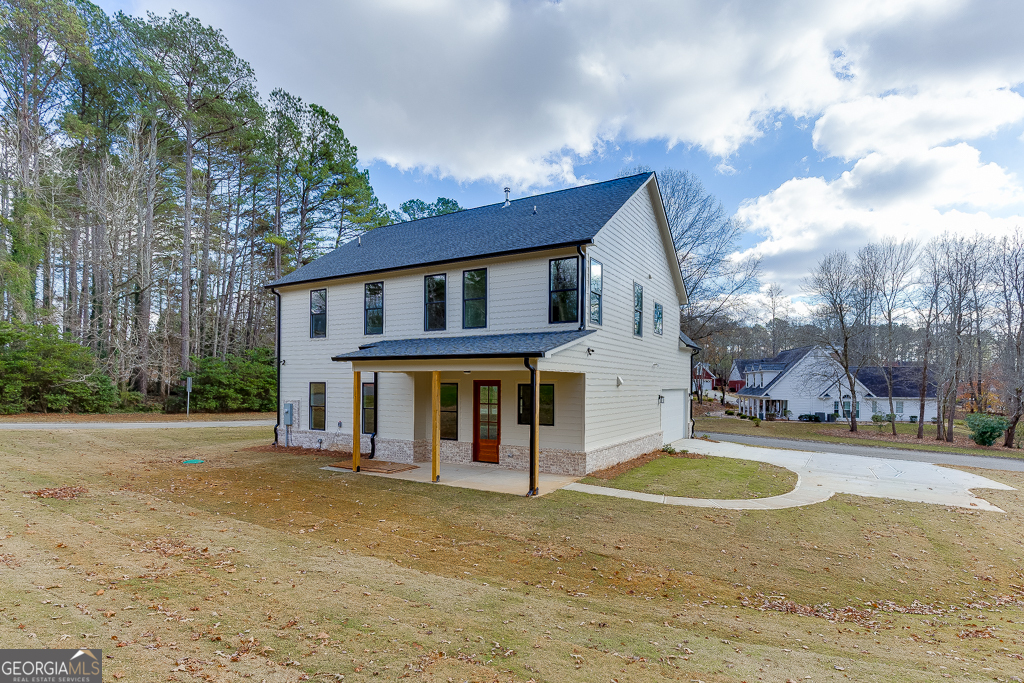 5422 Copper Crk Road Flowery Branch, GA 30542 - Photo 50 of 57 a view of a house with backyard and garden