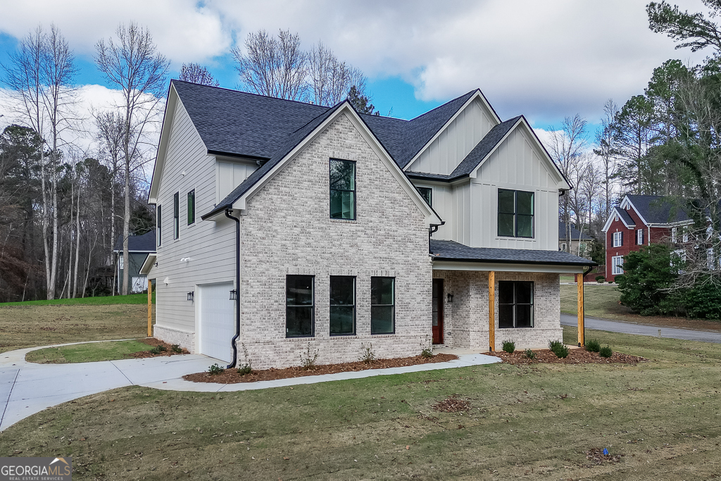 5422 Copper Crk Road Flowery Branch, GA 30542 - Photo 52 of 57 a front view of a house with a yard