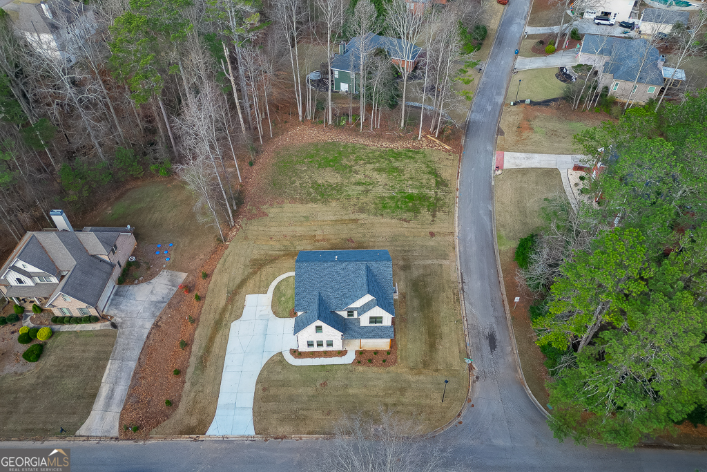 5422 Copper Crk Road Flowery Branch, GA 30542 - Photo 55 of 57 an aerial view of a house with garden space sitting space and garden