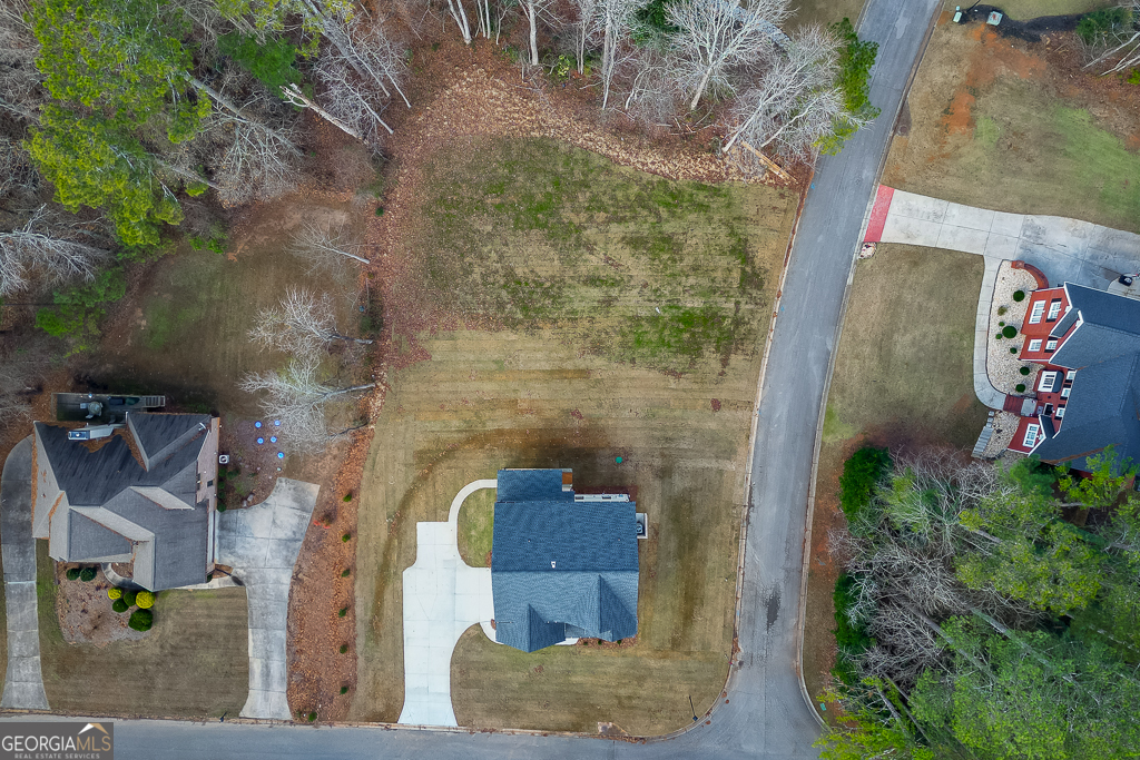 5422 Copper Crk Road Flowery Branch, GA 30542 - Photo 56 of 57 an aerial view of a house with a yard