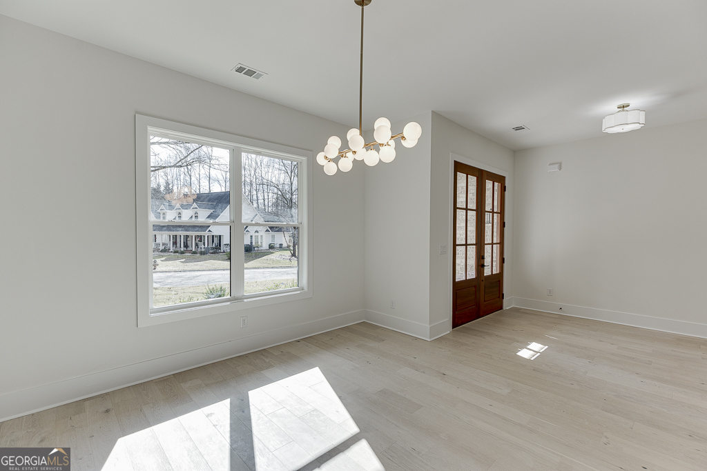 5422 Copper Crk Road Flowery Branch, GA 30542 - Photo 7 of 57 a view of an empty room with a window and bathroom