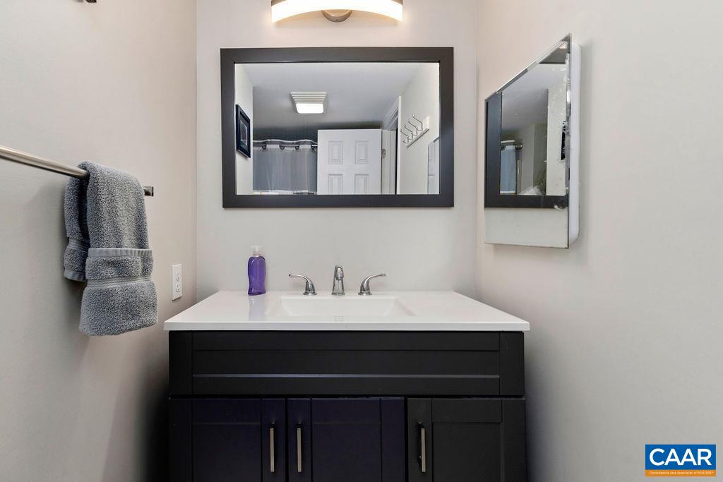 2070 Stone Ridge Wintergreen, VA 22967 - Photo 19 of 52 a bathroom with a sink vanity and a mirror