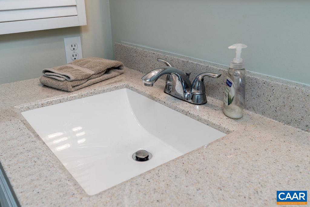 2070 Stone Ridge Wintergreen, VA 22967 - Photo 25 of 52 a bathroom with a granite countertop sink