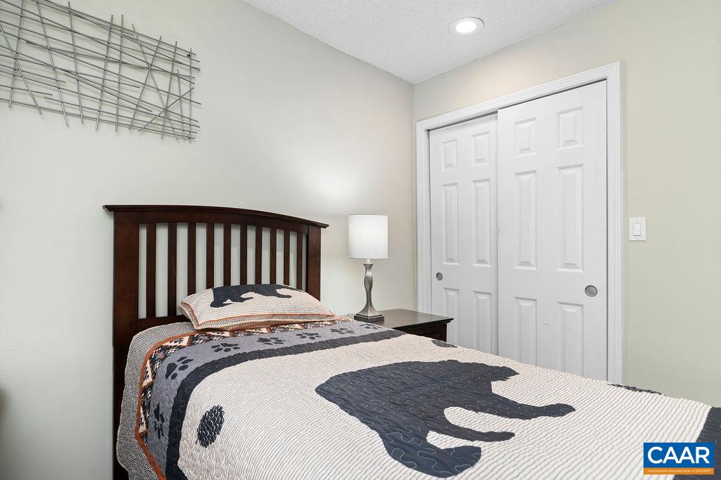 2070 Stone Ridge Wintergreen, VA 22967 - Photo 28 of 52 a bedroom with a bed and a table
