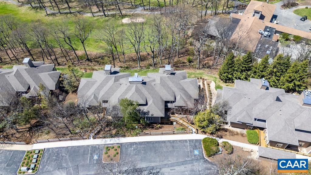 2070 Stone Ridge Wintergreen, VA 22967 - Photo 40 of 52 an aerial view of a house with a garden and lake view