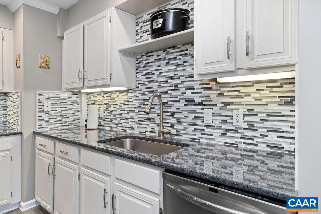 2070 Stone Ridge Wintergreen, VA 22967 - Photo 9 of 52 a kitchen with granite countertop white cabinets and stainless steel appliances