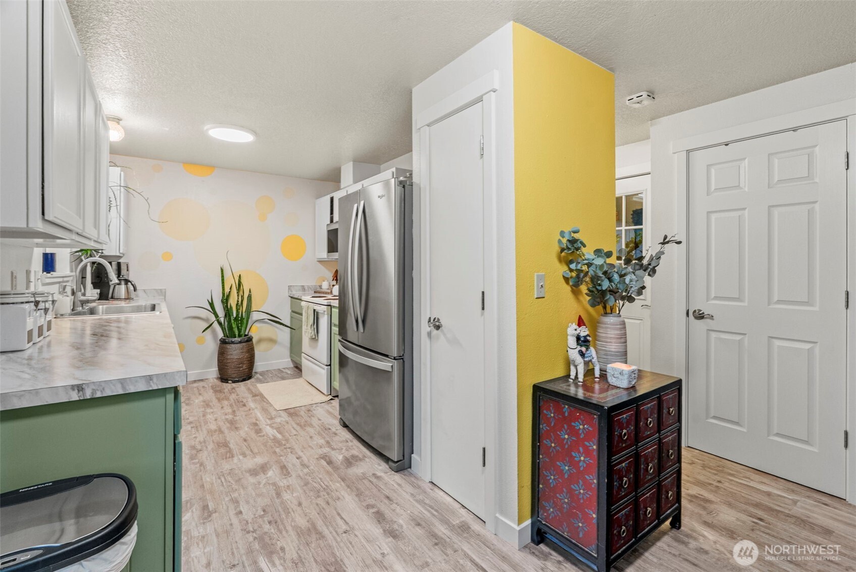 324 Cedar Court Winlock, WA 98596 - Photo 12 of 25 a kitchen with a refrigerator and a sink