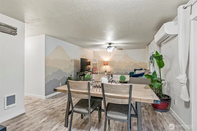 a view of a dining room with furniture window and wooden floor