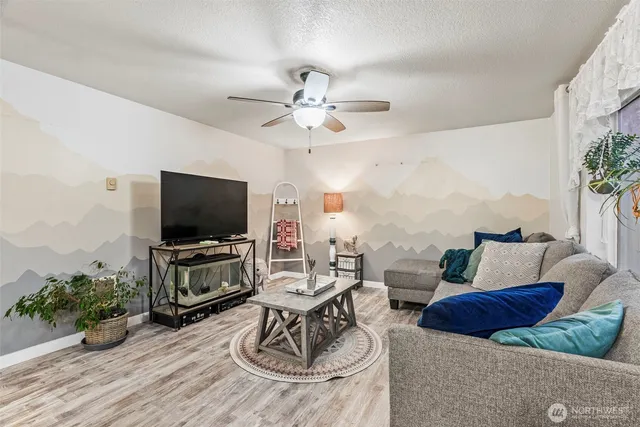 a living room with furniture and a flat screen tv