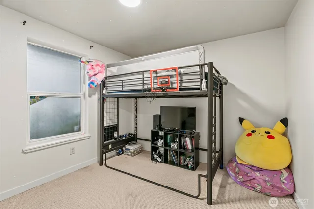 a bedroom with furniture and a window