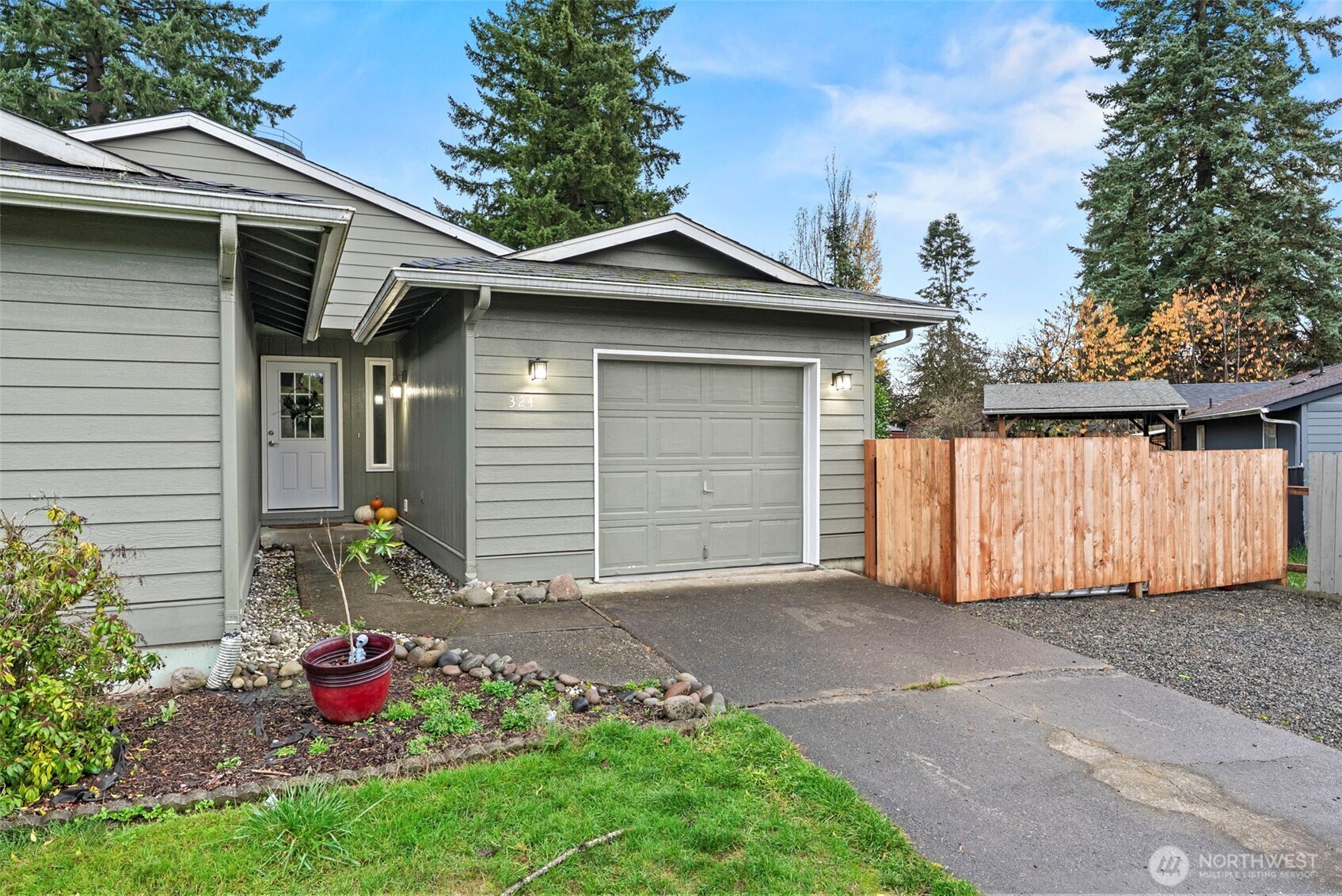324 Cedar Court Winlock, WA 98596 - Photo 4 of 25 a front view of a house with a yard