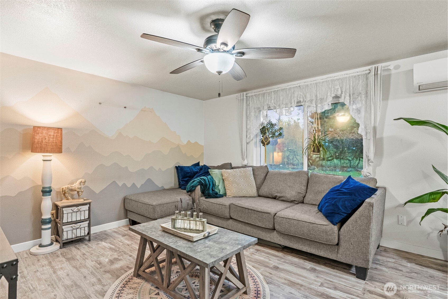324 Cedar Court Winlock, WA 98596 - Photo 7 of 25 a living room with furniture and a chandelier