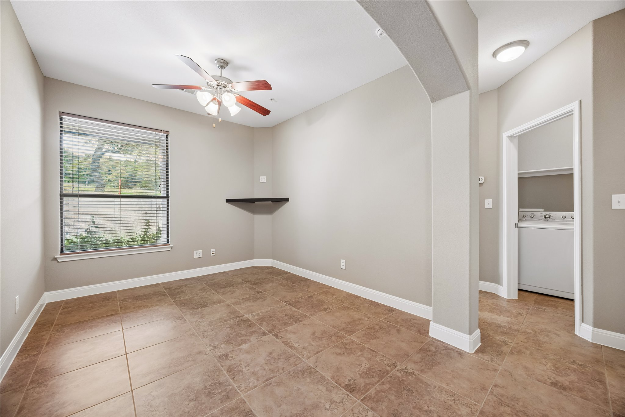 6705 Covered Bridge Drive, Unit 24 Austin, TX 78736 - Photo 21 of 31 an empty room with windows and fan