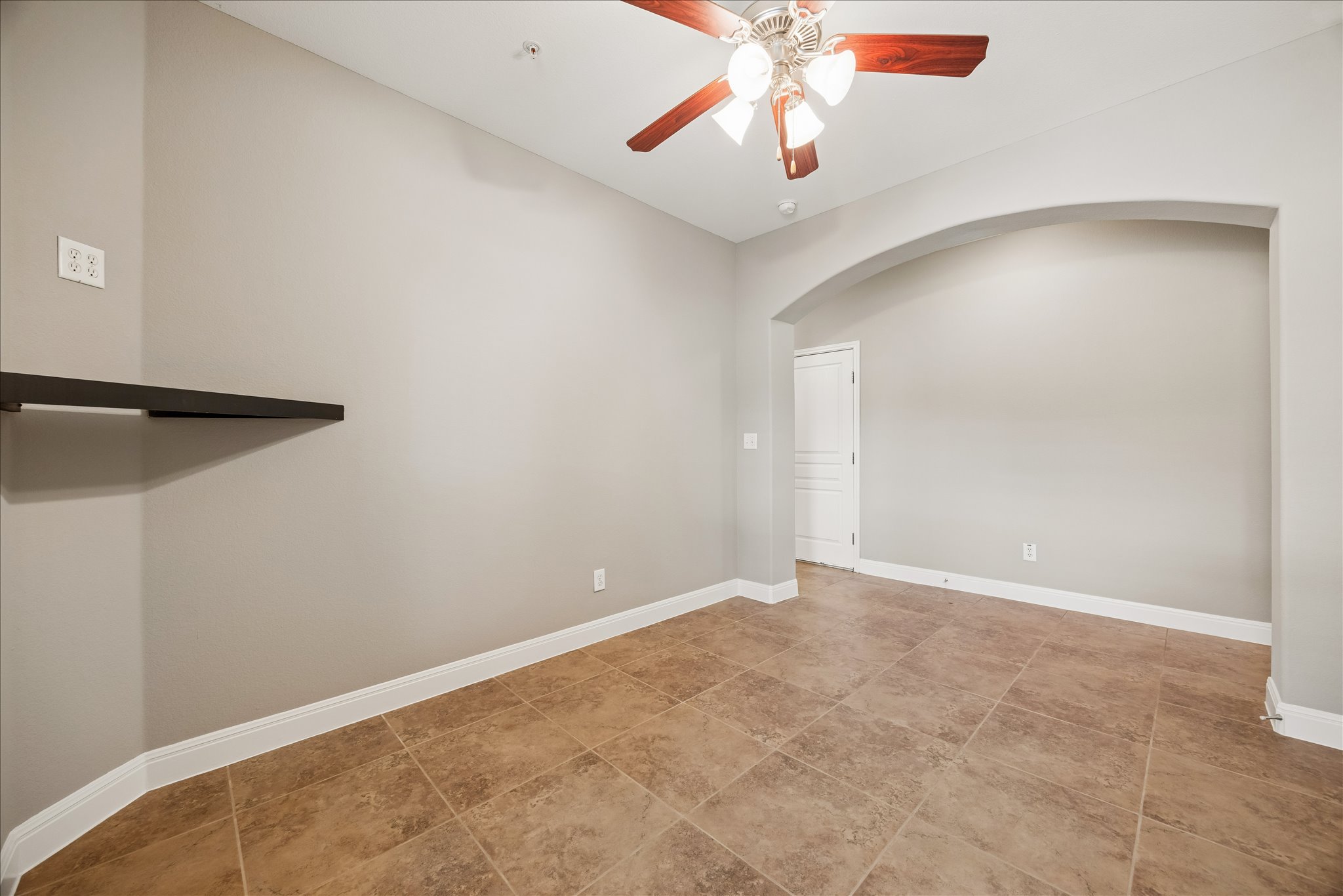6705 Covered Bridge Drive, Unit 24 Austin, TX 78736 - Photo 22 of 31 an empty room with windows and fan