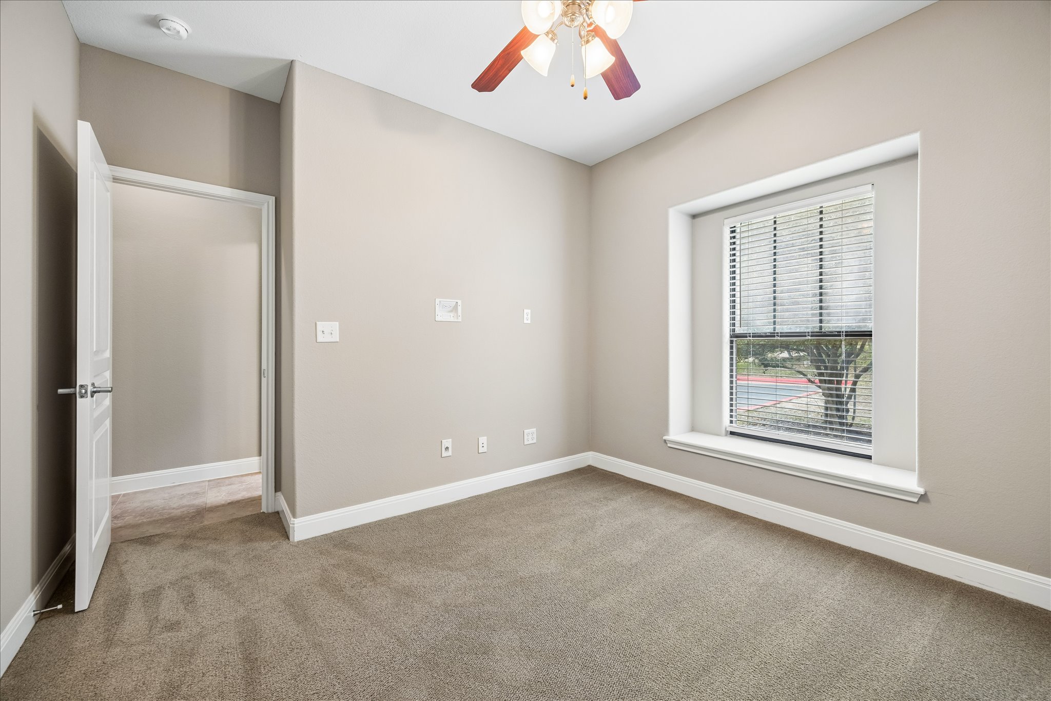 6705 Covered Bridge Drive, Unit 24 Austin, TX 78736 - Photo 24 of 31 an empty room with windows and closet