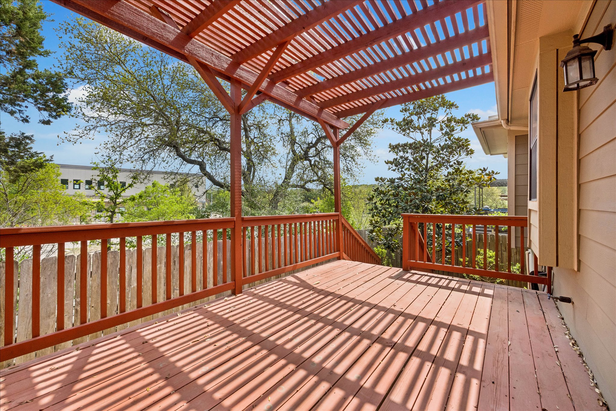6705 Covered Bridge Drive, Unit 24 Austin, TX 78736 - Photo 27 of 31 a view of balcony with wooden floor