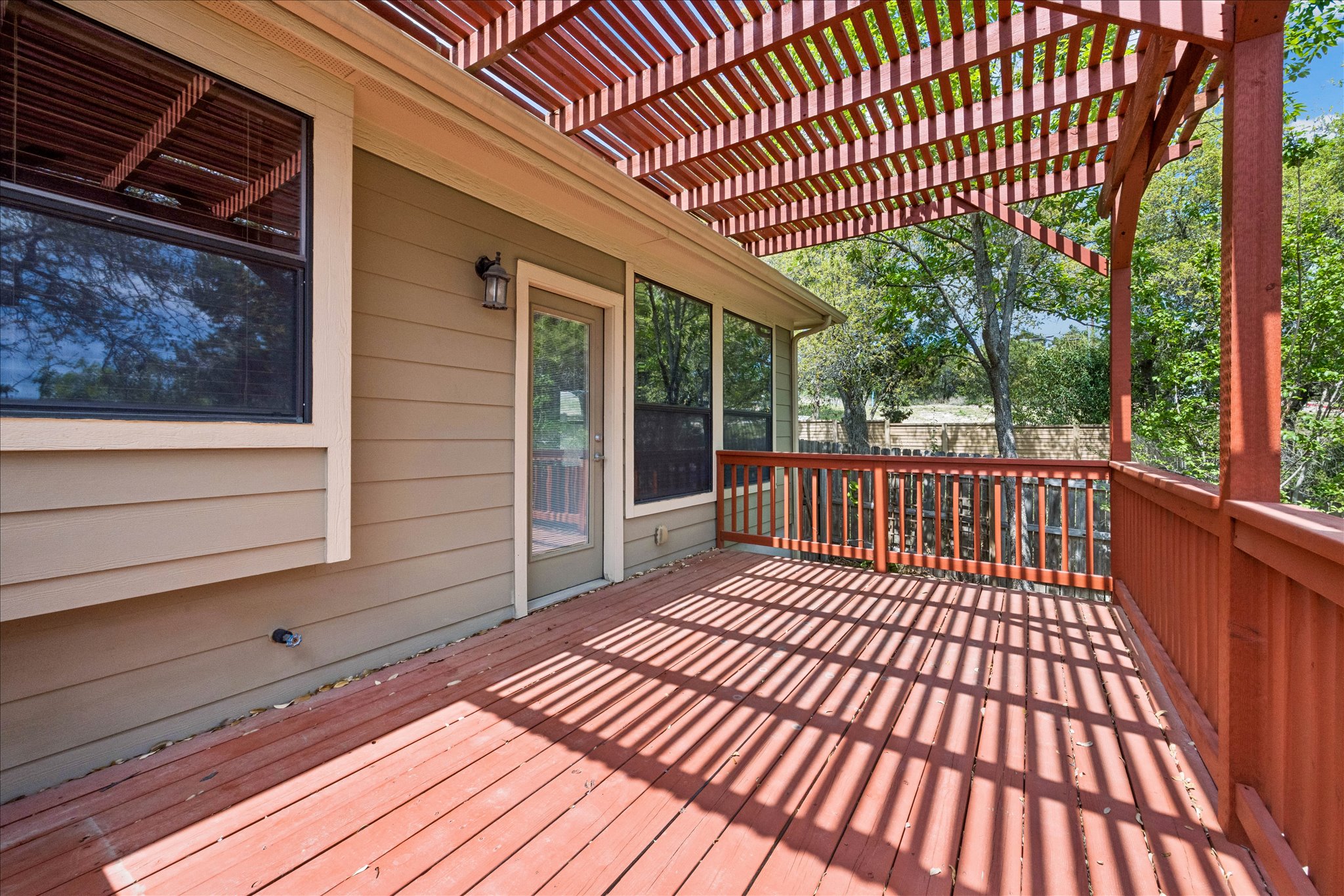 6705 Covered Bridge Drive, Unit 24 Austin, TX 78736 - Photo 28 of 31 a view of balcony with wooden floor