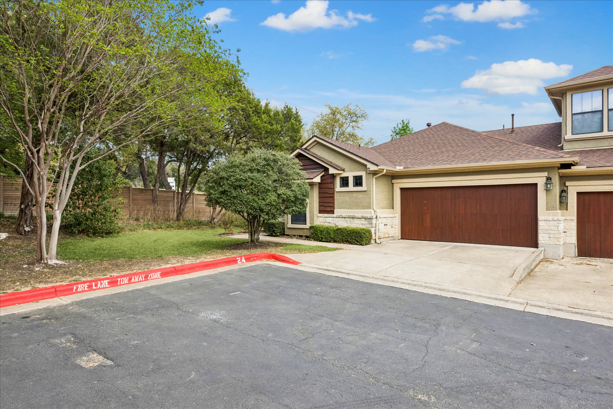 6705 Covered Bridge Drive, Unit 24 Austin, TX 78736 - Photo 31 of 31 a house with trees in the background