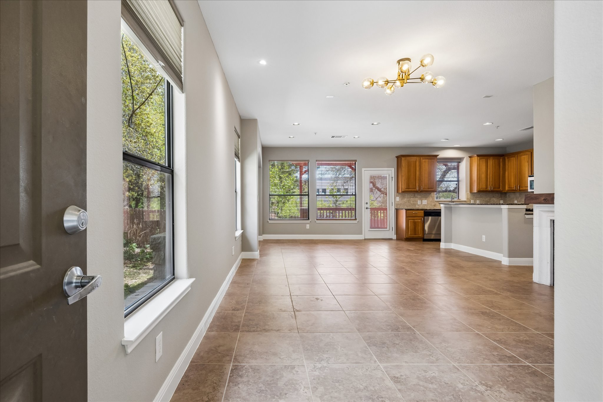 6705 Covered Bridge Drive, Unit 24 Austin, TX 78736 - Photo 5 of 31 a view of a kitchen with furniture and a window
