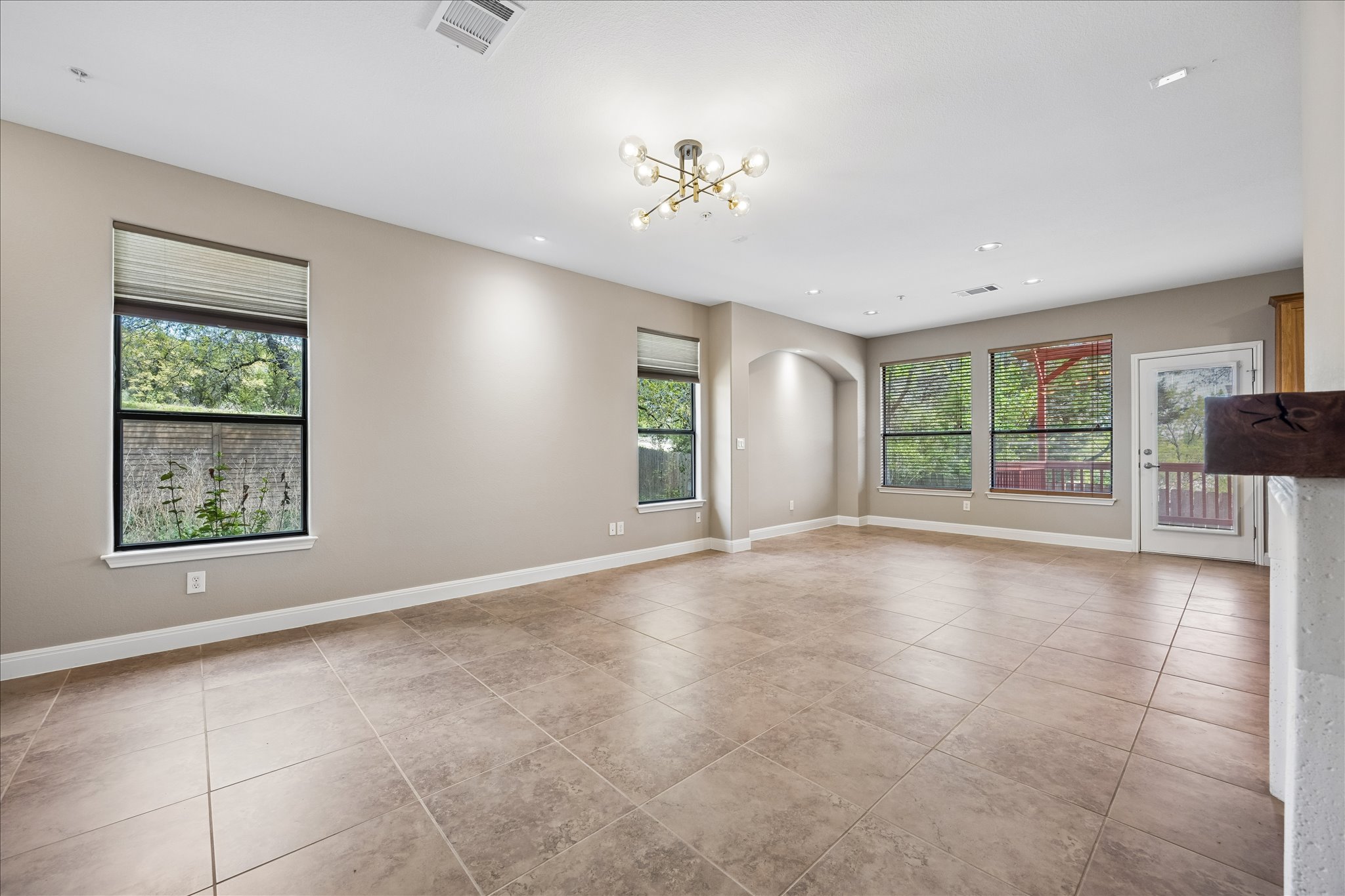 6705 Covered Bridge Drive, Unit 24 Austin, TX 78736 - Photo 6 of 31 a view of an empty room with a window