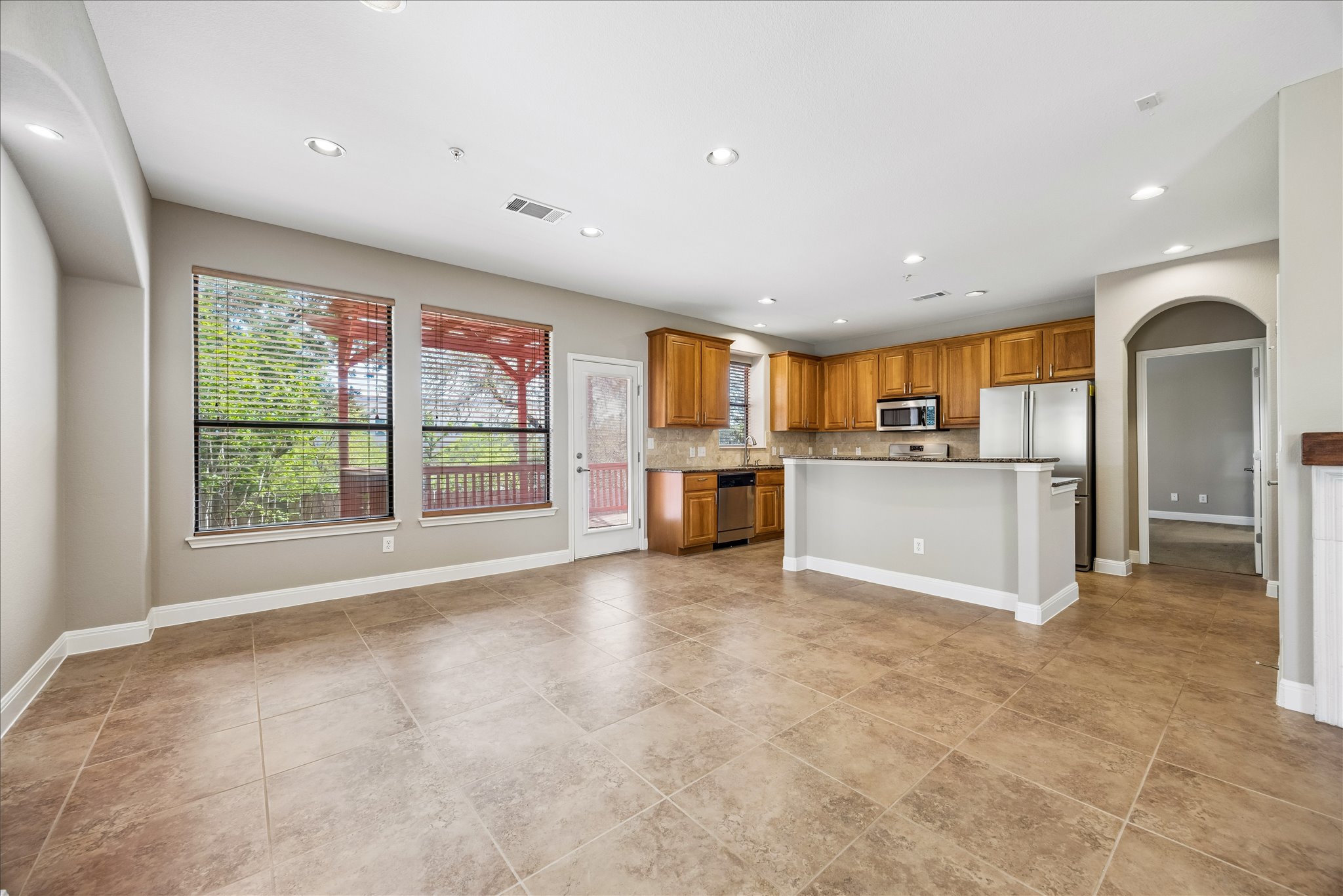 6705 Covered Bridge Drive, Unit 24 Austin, TX 78736 - Photo 8 of 31 a view of a kitchen with a sink and a large window
