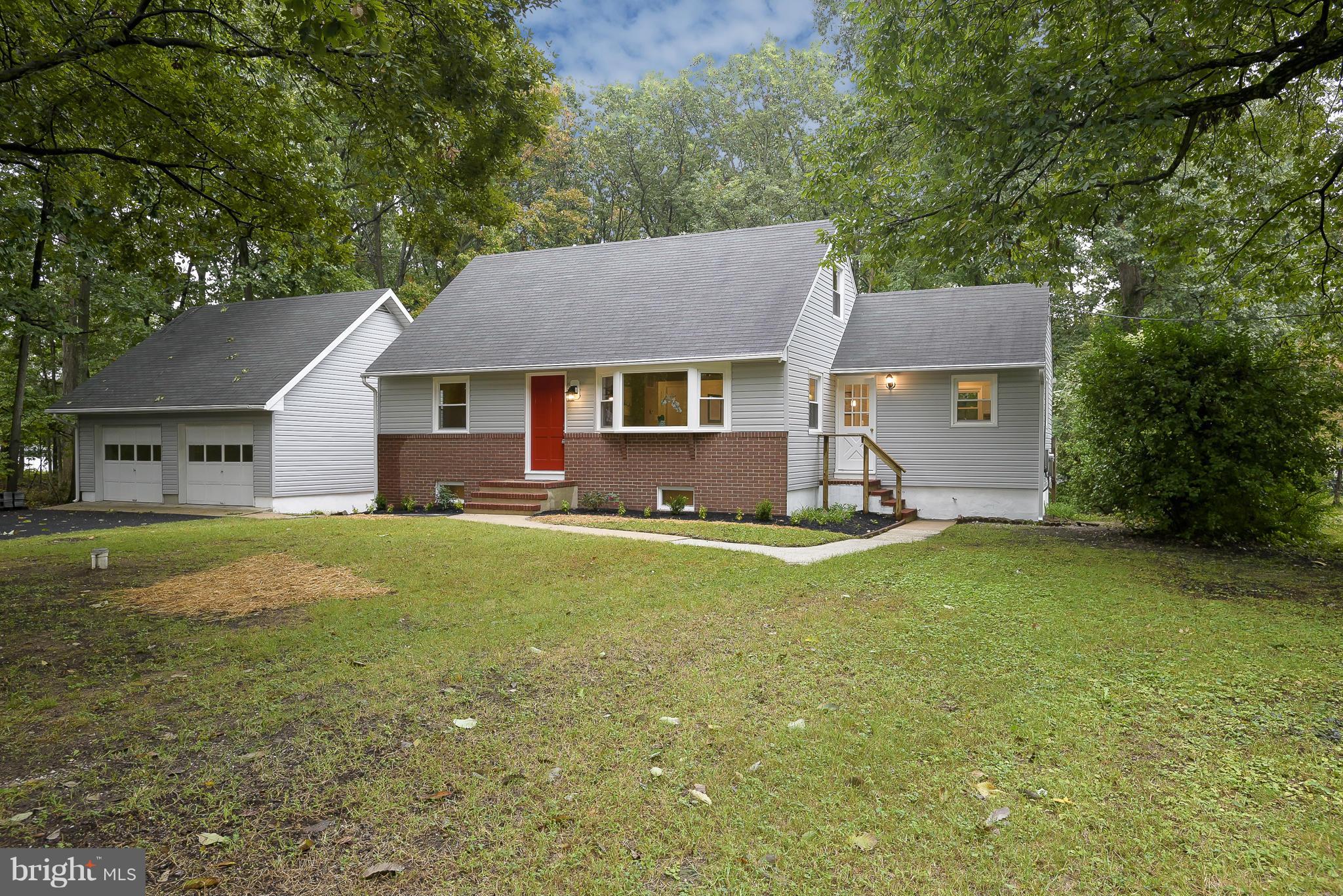 8413 Garland Road Pasadena, MD 21122 - Photo 2 of 30 a house view with a garden space