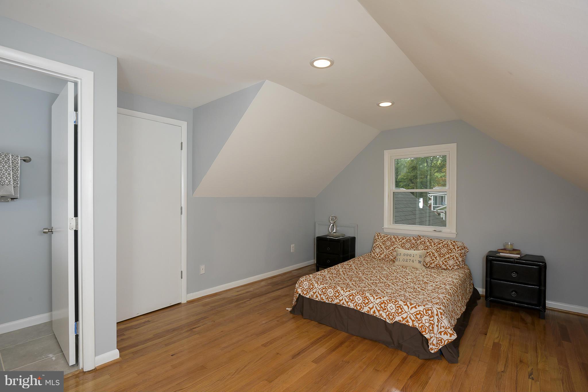 8413 Garland Road Pasadena, MD 21122 - Photo 13 of 30 a bedroom with a bed and a tv