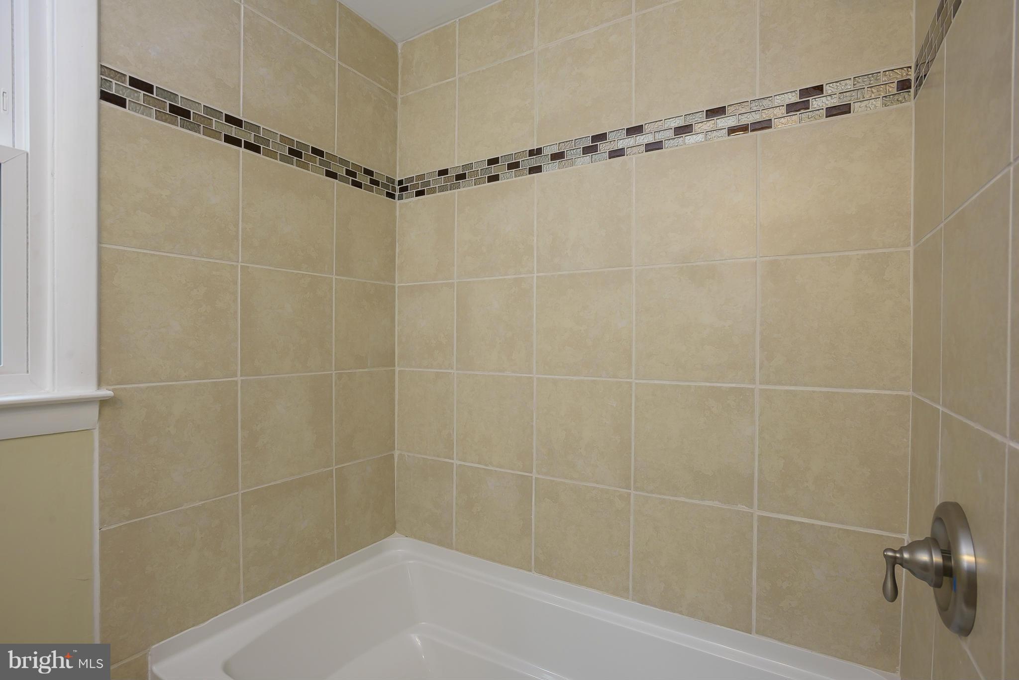 8413 Garland Road Pasadena, MD 21122 - Photo 19 of 30 a bathroom with a shower