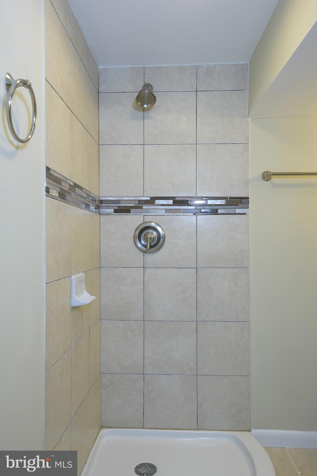 8413 Garland Road Pasadena, MD 21122 - Photo 26 of 30 a bathroom with a shower and a window