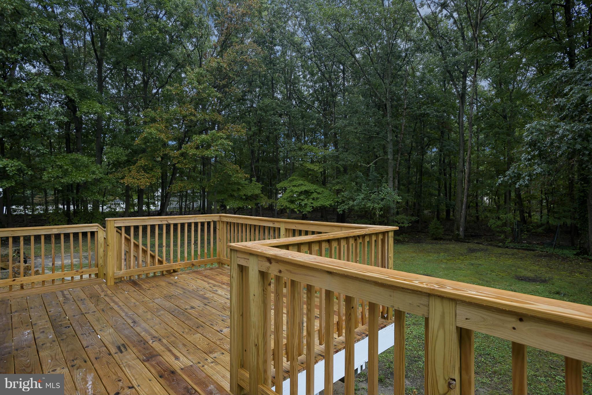 8413 Garland Road Pasadena, MD 21122 - Photo 28 of 30 a view of balcony with deck and trees