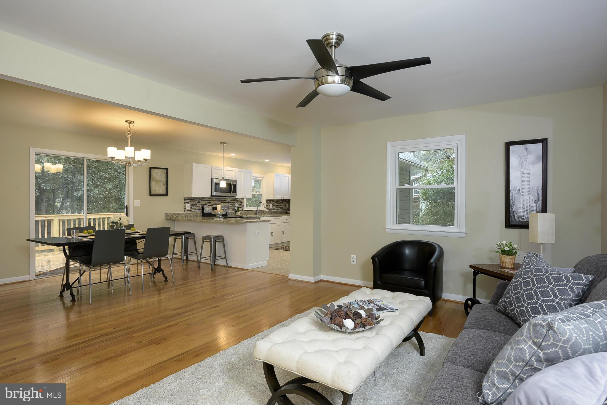 8413 Garland Road Pasadena, MD 21122 - Photo 5 of 30 a living room with furniture and a wooden floor