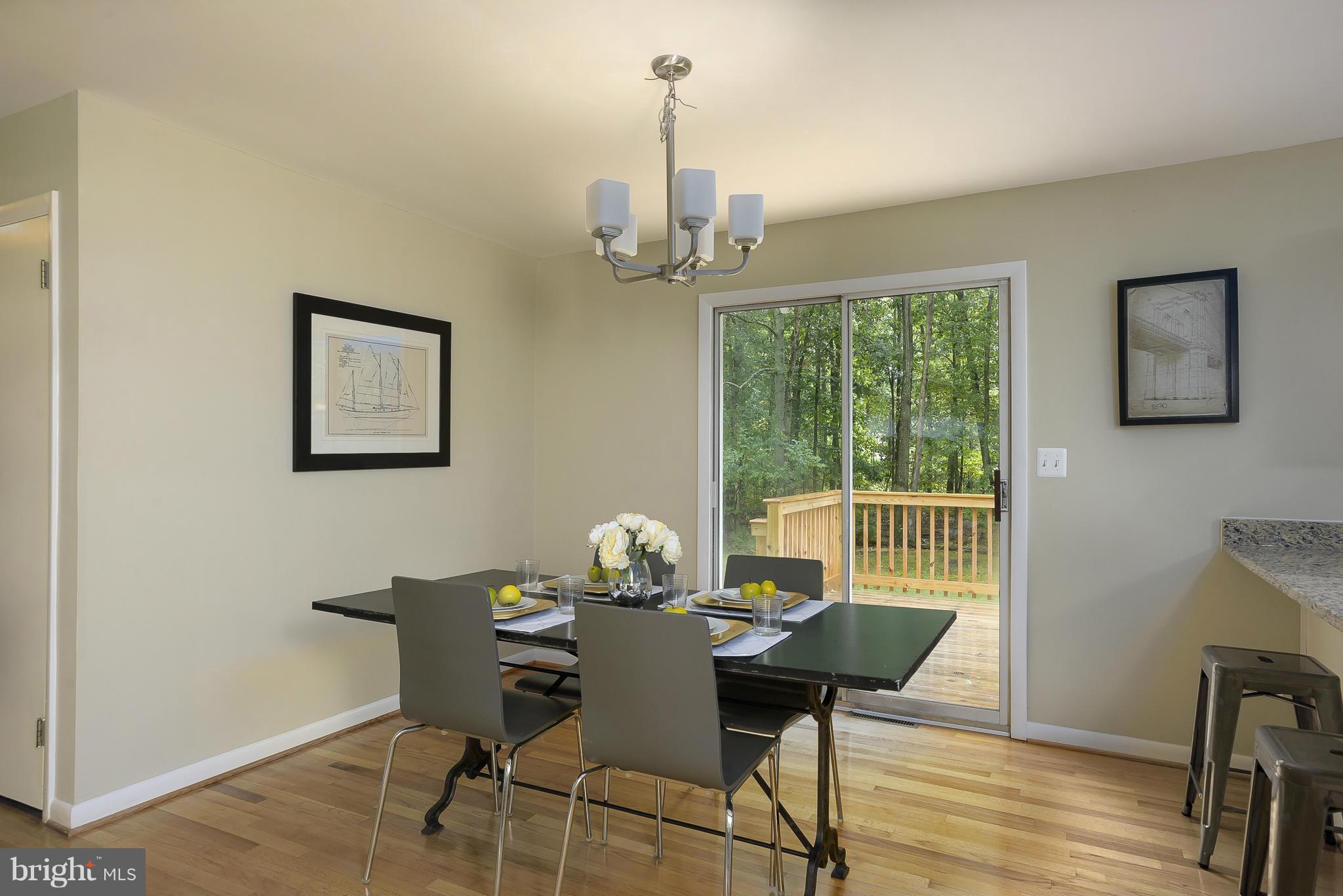 8413 Garland Road Pasadena, MD 21122 - Photo 8 of 30 a view of a dining room with furniture window and wooden floor