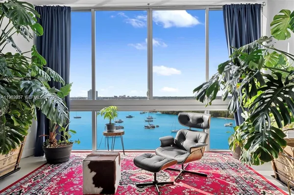 a view of a chairs and table in patio