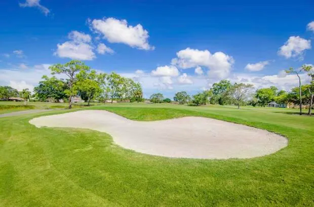 a view of a golf course with a garden