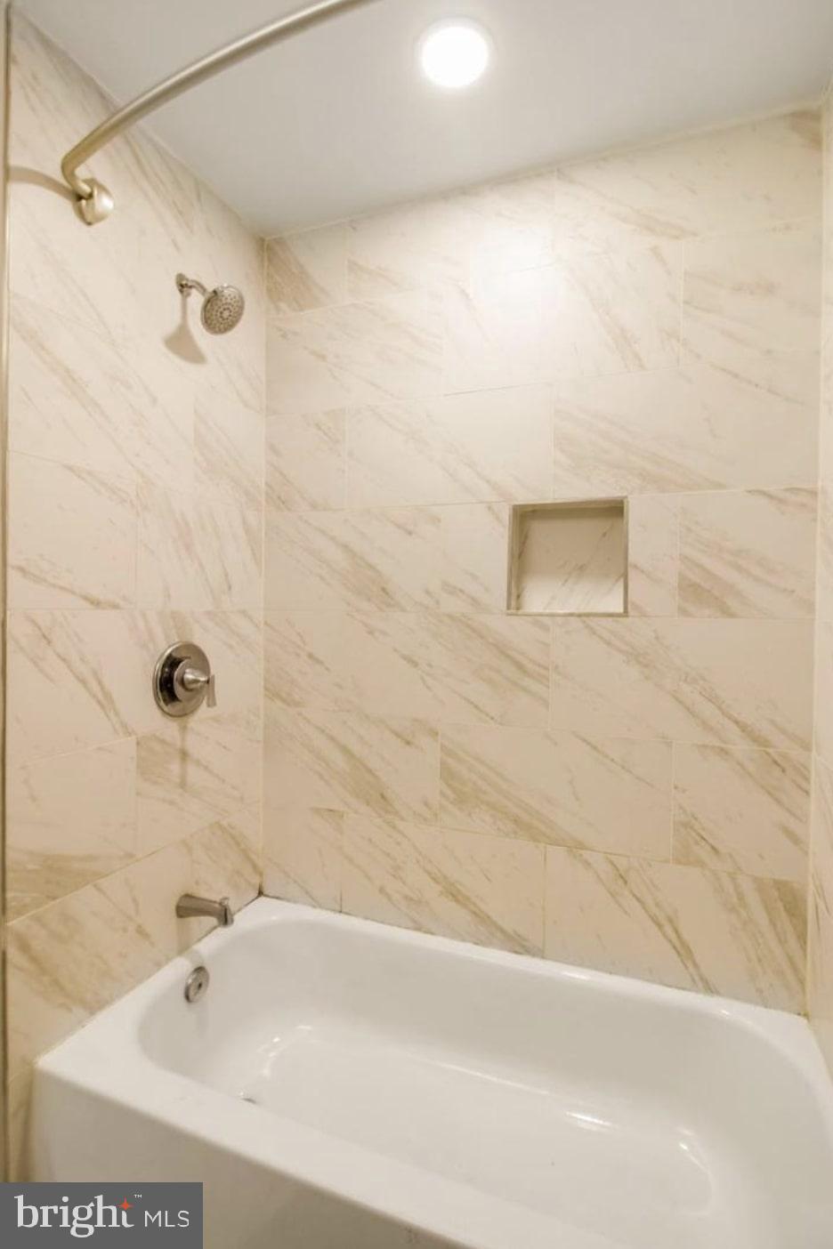 1149 Summit Street Northeast, Unit 2 Washington, DC 20002 - Photo 13 of 14 a bathroom with a bathtub