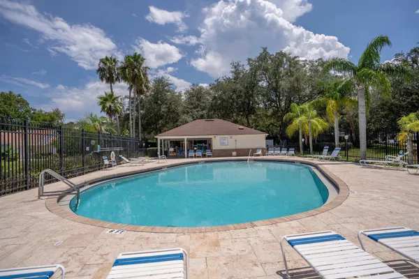 a view of a swimming pool with a patio