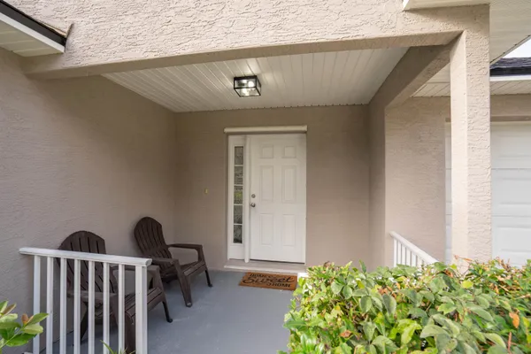 a view of a porch with furniture