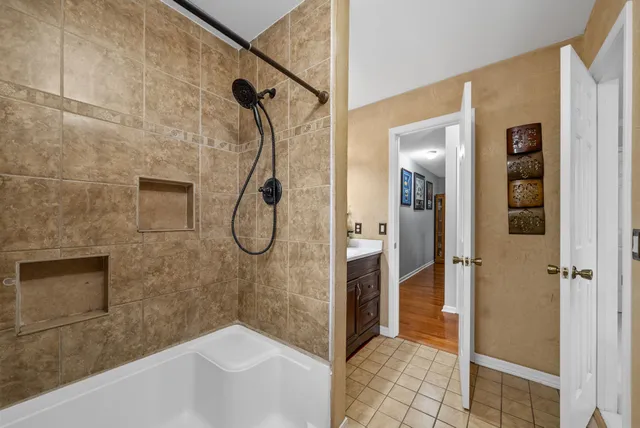 a bathroom with a sink toilet mirror and vanity