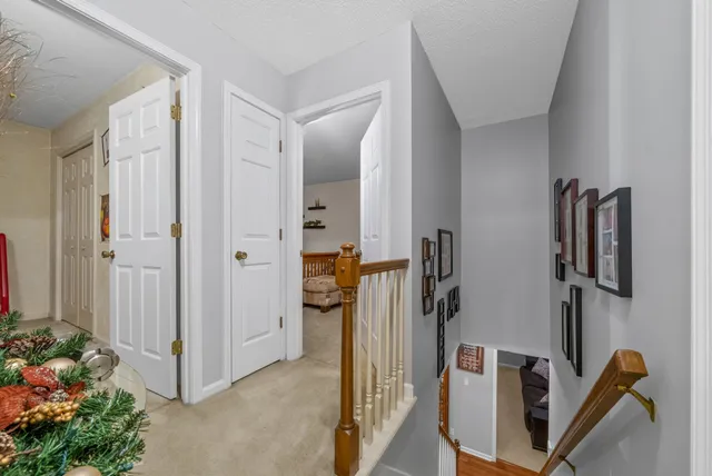 a bedroom with a bed and flat screen tv