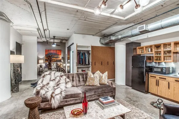 a kitchen with stainless steel appliances granite countertop a refrigerator stove and sink