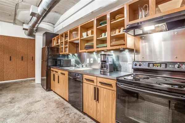 a kitchen with a stove and a microwave