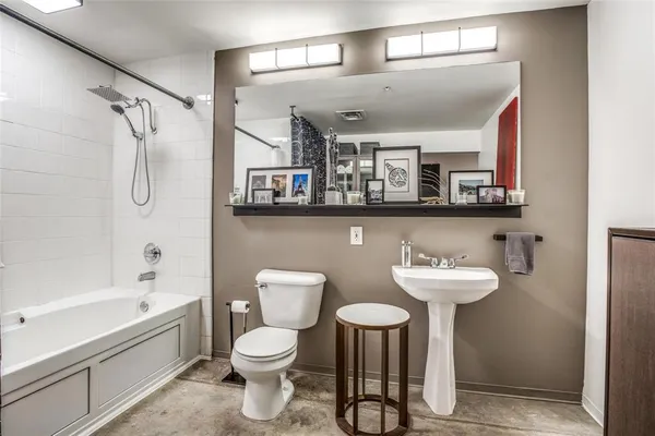 a bathroom with a shower and a tub