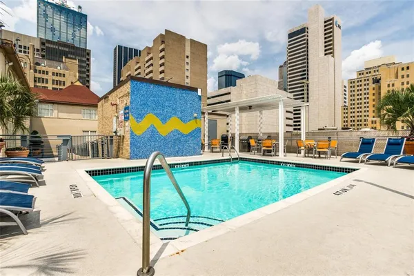 a view of yard with swimming pool outdoor seating