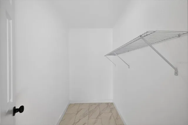 a view of a room with racks on the wall