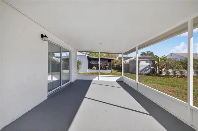 a view of livingroom with furniture and floor to ceiling window
