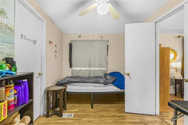 a living room with furniture and a book shelf