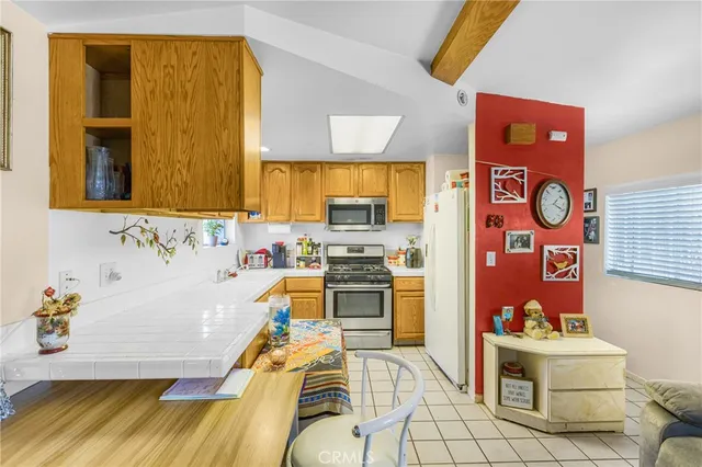 a kitchen with a sink and a refrigerator
